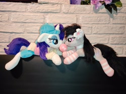 Size: 4640x3472 | Tagged: artist needed, safe, octavia melody, rarity, earth pony, pony, unicorn, g4, alternate hairstyle, clothes, disguise, duo, female, flower, flower in hair, irl, lesbian, lying down, photo, plainity, plushie, prone, raritavia, shipping, socks, striped socks