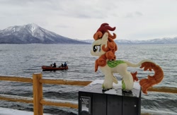 Size: 2048x1339 | Tagged: safe, photographer:pakapaka1993, autumn blaze, human, kirin, g4, boat, irl, irl human, japan, photo, plushie, solo, water