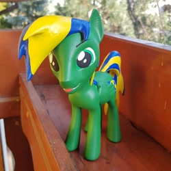 Size: 1024x1024 | Tagged: safe, artist:mraagh, oc, oc only, oc:chacek, pegasus, pony, 3d, 3d print, eyebrows, eyes open, figurine, green coat, green eyes, irl, male, multicolored hair, multicolored mane, photo, shadow, silly, solo, spiky mane, stallion, standing, statue, tongue out