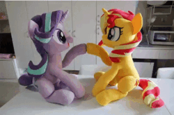 Size: 540x359 | Tagged: safe, artist:nekokevin, starlight glimmer, sunset shimmer, pony, unicorn, series:nekokevin's glimmy, g4, animated, cute, duo, female, gif, glimmerbetes, hoofbump, irl, looking at each other, mare, open mouth, playing, plushie, raised hoof, shimmerbetes, sitting, smiling, stop motion
