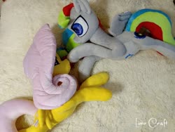 Size: 720x540 | Tagged: safe, artist:limecraft, fluttershy, oc, oc:unya, pegasus, pony, g4, belly, big belly, boop, duo, irl, lying down, male, male pregnancy, on side, paternity mark, photo, plushie, pregnant, spread wings, wings