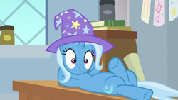 Size: 1280x720 | Tagged: safe, screencap, trixie, pony, unicorn, a horse shoe-in, g4, awkward moment, book, classroom, clothes, desk, female, hat, mare, solo, trixie's hat