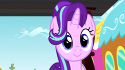 Size: 1312x738 | Tagged: safe, screencap, starlight glimmer, pony, unicorn, all bottled up, g4, cute, female, glimmerbetes, looking at you, mare, ponyville, smiling, solo, train, train station