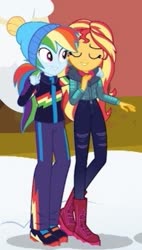 Size: 299x528 | Tagged: safe, screencap, rainbow dash, sunset shimmer, equestria girls, equestria girls series, g4, holidays unwrapped, spoiler:eqg series (season 2), beanie, boots, clothes, cropped, female, hat, shoes, sneakers, winter outfit
