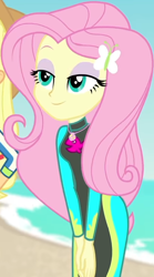 Size: 454x815 | Tagged: safe, screencap, applejack, fluttershy, butterfly, equestria girls, equestria girls specials, g4, my little pony equestria girls: better together, my little pony equestria girls: forgotten friendship, beach, bodysuit, clothes, cropped, cute, female, fluttershy's wetsuit, geode of fauna, hairclip, hands together, jewelry, lidded eyes, long sleeves, magical geodes, necklace, ocean, sand, shyabetes, sky, smiling, swimsuit, wetsuit