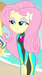 Size: 460x814 | Tagged: safe, screencap, applejack, fluttershy, butterfly, equestria girls, equestria girls series, forgotten friendship, g4, beach, bodysuit, clothes, cloud, cropped, cute, female, geode of fauna, hairclip, hands together, jewelry, lidded eyes, long sleeves, magical geodes, necklace, ocean, sand, shyabetes, smiling, swimsuit, wetsuit