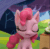Size: 457x450 | Tagged: safe, screencap, pinkie pie, earth pony, pony, g4.5, my little pony: stop motion short, pinkie pie vs the flowers, animated, cropped, female, gif, nervous smile, outdoors, raised hoof, sheepish grin, solo, stop motion, tree