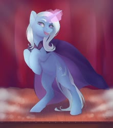 Size: 1024x1159 | Tagged: safe, artist:nekotoko, trixie, pony, unicorn, g4, bipedal, cape, clothes, ear fluff, female, glowing horn, hooves to the chest, horn, magic, mare, open mouth, rearing, smiling, solo, stage, trixie's cape