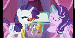 Size: 828x424 | Tagged: safe, screencap, rarity, spike, starlight glimmer, dragon, pony, unicorn, a-dressing memories, g4, my little pony: friendship is forever, 9now, book, eyes closed, female, glasses, levitation, magic, male, mare, measuring tape, nine network, rarity's glasses, telekinesis, unamused