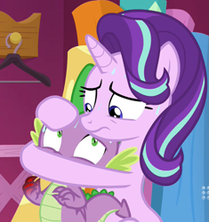 Size: 1001x1066 | Tagged: safe, screencap, spike, starlight glimmer, dragon, pony, unicorn, a-dressing memories, g4, my little pony: friendship is forever, 9now, abuse, holding, holding head, implied injury, nine network, spikeabuse, sweat, worried