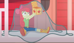 Size: 1482x857 | Tagged: safe, screencap, apple bloom, equestria girls, equestria girls series, g4, holidays unwrapped, the cider louse fools, spoiler:eqg series (season 2), adorabloom, apple bloom's bow, boots, bow, box, caught, clothes, cropped, cute, female, hair bow, house, jack-in-the-box, jeans, lifting, net, pants, shirt, shoes, sitting, solo, surprised
