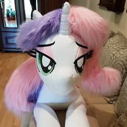 Size: 1355x1355 | Tagged: safe, artist:ponimalion, sweetie belle, pony, unicorn, g4, bed, female, irl, life size, mare, older, older sweetie belle, photo, plushie, prone