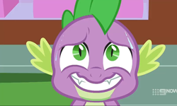 Size: 1204x720 | Tagged: safe, screencap, spike, dragon, cakes for the memories, g4, my little pony: friendship is forever, 9now, adorkable, cute, dork, fangs, male, nervous smile, solo, sweat, winged spike, wings