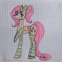 Size: 880x880 | Tagged: safe, artist:thevitiushadurachok, fluttershy, pegasus, pony, g4, alternate hairstyle, bow, clothes, female, graph paper, hair bow, mare, raised hoof, smiling, socks, solo, striped socks, traditional art