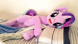 Size: 1024x576 | Tagged: safe, artist:nekokevin, starlight glimmer, pony, unicorn, series:nekokevin's glimmy, g4, :d, bed, bedsheets, cute, female, glimmerbetes, happy, irl, looking at you, lying down, mare, open mouth, photo, pillow, plushie, smiling, solo