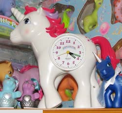 Size: 595x547 | Tagged: safe, photographer:tradertif, cotton candy (g1), moondancer (g1), sea pony, g1, clock, irl, merchandise, photo