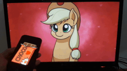 Size: 1920x1080 | Tagged: safe, ai assisted, ai content, artist:mkogwheel, fifteen.ai, applejack, g4, aivo, animated, avo, chocolate, cute, disembodied hand, food, frame by frame, hand, heart eyes, hearts and hooves day, hnnng, holiday, irl, jackabetes, mkogwheel is trying to kill us, monitor, phone, photo, sound, speech bubble, valentine's day, webm, wingding eyes