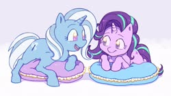 Size: 2048x1152 | Tagged: dead source, safe, artist:chapaghettii, starlight glimmer, trixie, pony, unicorn, g4, cushion, cute, duo, female, looking at each other, lying down, mare, no pupils, open mouth, prone, smiling