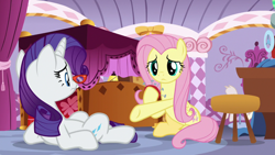 Size: 1920x1080 | Tagged: safe, screencap, fluttershy, rarity, pegasus, pony, unicorn, dragon dropped, g4, bed, duo, female, frown, glasses, hoof hold, mare, on back, pincushion, rarity's glasses, underhoof