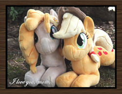 Size: 1650x1275 | Tagged: safe, artist:peruserofpieces, applejack, pear butter, earth pony, pony, g4, beanie (plushie), female, irl, looking at you, mare, mother and child, mother and daughter, photo, plushie, prone