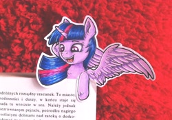 Size: 3705x2577 | Tagged: safe, artist:rysunkowasucharia, twilight sparkle, alicorn, pony, g4, book, bookmark, colored pencil drawing, cute, cutout, female, high res, irl, mare, photo, polish, pony bookmark, solo, spread wings, text, that pony sure does love books, the plague (novel), traditional art, twiabetes, twilight sparkle (alicorn), wings
