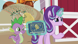 Size: 1280x720 | Tagged: safe, screencap, spike, starlight glimmer, dragon, pony, unicorn, g4, harvesting memories, my little pony: friendship is forever, 9now, book, carrot, carrot farm, duo, duo male and female, female, food, glowing, glowing horn, grin, hands behind back, hay, horn, levitation, magic, magic aura, male, mare, nervous, nervous smile, raised hoof, smiling, sweet apple acres, sweet apple acres barn, telekinesis, winged spike, wings, worried
