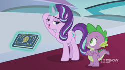 Size: 1280x720 | Tagged: safe, screencap, spike, starlight glimmer, dragon, pony, unicorn, g4, memories and more, spoiler:memories and more, spoiler:mlp friendship is forever, 9now, bedroom eyes, book, crossed arms, duo, levitation, looking at each other, magic, magic aura, scrapbook, telekinesis, winged spike, wings