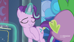 Size: 1280x720 | Tagged: safe, screencap, spike, starlight glimmer, dragon, pony, unicorn, g4, memories and more, my little pony: friendship is forever, 9now, book, duo, eyes closed, levitation, magic, magic aura, mid-blink screencap, scrapbook, smiling, telekinesis, winged spike, wings