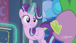 Size: 1280x720 | Tagged: safe, screencap, spike, starlight glimmer, dragon, pony, unicorn, g4, memories and more, spoiler:memories and more, spoiler:mlp friendship is forever, 9now, book, duo, levitation, looking at each other, magic, magic aura, scrapbook, smiling, telekinesis, winged spike, wings