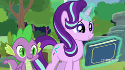 Size: 1280x720 | Tagged: safe, screencap, spike, starlight glimmer, dragon, pony, unicorn, g4, memnagerie, my little pony: friendship is forever, baby dragon, book, cute, duo, female, glimmerbetes, glowing horn, hair flip, horn, levitation, magic, magic aura, male, mare, scrapbook, slit pupils, smiling, telekinesis, winged spike, wings