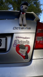 Size: 4128x2322 | Tagged: safe, octavia melody, earth pony, pony, g4, background pony, car, eyes closed, female, heart, implied crush, irl, mare, namesake, photo, plushie, skoda octavia, solo