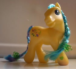 Size: 665x601 | Tagged: safe, photographer:lilcricketnoise, meadowbrook (g3), earth pony, pony, g3, braid, braided tail, female, hairclip, irl, mare, photo, solo, tail, toy