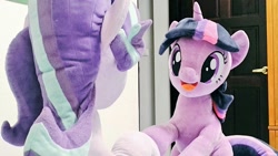 Size: 1024x576 | Tagged: safe, artist:nekokevin, starlight glimmer, twilight sparkle, pony, unicorn, series:nekokevin's glimmy, g4, duo, female, irl, looking at each other, mare, open mouth, photo, plushie, raised hoof, rear view, sitting, smiling, underhoof, unicorn twilight