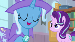 Size: 1920x1080 | Tagged: safe, screencap, starlight glimmer, trixie, pony, unicorn, a horse shoe-in, g4, cape, clothes, duo, eyes closed, female, hat, mare, trixie's cape, trixie's hat