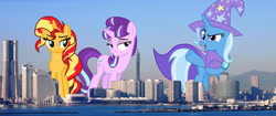 Size: 4000x1679 | Tagged: safe, artist:8-notes, artist:cloudy glow, artist:starlessnight22, artist:theotterpony, edit, vector edit, starlight glimmer, sunset shimmer, trixie, pony, unicorn, g4, female, giant pony, giant starlight glimmer, giant trixie, giant unicorn, giant/macro sunset shimmer, highrise ponies, irl, japan, lidded eyes, macro, mare, mega trixie, photo, ponies in real life, s5 starlight, smiling, smirk, trio, vector, yokohama