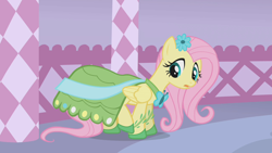 Size: 1280x720 | Tagged: safe, screencap, fluttershy, pony, g4, season 1, suited for success, clothes, dress, female, flower, flower in hair, gala dress, mare, solo