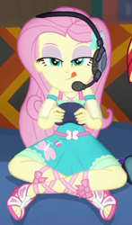 Size: 324x551 | Tagged: safe, screencap, fluttershy, human, equestria girls, g4, game stream, my little pony equestria girls: better together, controller, cropped, crossed legs, cute, female, geode of fauna, hairpin, headphones, magical geodes, shyabetes, tongue out