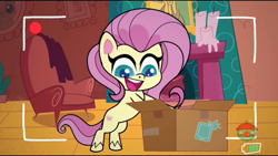 Size: 1280x720 | Tagged: safe, screencap, fluttershy, pegasus, pony, g4.5, my little pony: pony life, unboxing day, animation error, bipedal, bipedal leaning, box, earth pony fluttershy, female, flutterbox, fluttershy's cottage, leaning, missing wing, recording, smiling, solo, treehouse logo, wingless