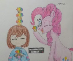 Size: 1080x912 | Tagged: safe, artist:poorunii, pinkie pie, earth pony, human, pony, g4, colored pencil drawing, crossover, cupcake, food, frisk, korean, one eye closed, rainbow cupcake, smiling, traditional art, undertale, wink