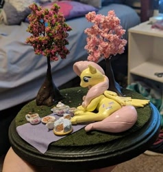 Size: 578x606 | Tagged: safe, artist:blackdawnyaoilover, fluttershy, pegasus, pony, g4, cake, cookie, craft, cup, food, irl, lying down, on side, photo, picnic, sculpture, solo, teacup, teapot, traditional art