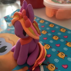 Size: 1080x1080 | Tagged: dead source, safe, artist:_alana_wolli_, oc, oc only, earth pony, pony, bow, craft, earth pony oc, hair bow, irl, photo, play doh, sculpture, sitting, solo, traditional art