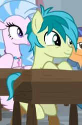 Size: 268x405 | Tagged: safe, screencap, fine catch, sandbar, silverstream, classical hippogriff, earth pony, hippogriff, pony, a rockhoof and a hard place, g4, cropped, cute, desk, friendship student, sandabetes, sitting, smiling, solo focus