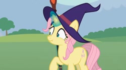 Size: 1680x942 | Tagged: safe, artist:agrol, fluttershy, pony, let's start the game, g4, female, hat, magic staff, solo, witch hat