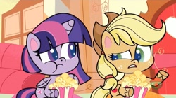 Size: 1667x933 | Tagged: safe, screencap, applejack, twilight sparkle, pony, director spike's mockumentary, g4.5, my little pony: pony life, duo, eating, female, food, gritted teeth, herbivore, mare, popcorn