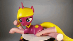 Size: 1920x1080 | Tagged: safe, artist:mraagh, oc, oc only, oc:autumn dawn, pony, unicorn, 3d, 3d print, anatomically incorrect, animated, big eyelashes, blue eyes, clothes, cute, cutie mark, eyelashes, eyes open, female, figure, figurine, gift art, gray coat, hair in mouth, happy, incorrect leg anatomy, irl, looking at you, lying down, mare, no sound, painted, photo, silly, simple background, socks, solo, statue, teeth, webm, yellow mane