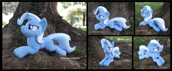Size: 4237x1754 | Tagged: safe, artist:peruserofpieces, trixie, pony, unicorn, g4, beanie (plushie), cocky, female, horn, irl, looking at you, lying down, mare, photo, plushie, prone, smiling, smiling at you, solo, sploot, tree