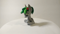 Size: 1920x1080 | Tagged: safe, artist:mraagh, oc, oc only, oc:sorunome, pegasus, pony, 3d, 3d print, animated, black background, clothes, cute, eyes open, female, figure, figurine, flower, flower in hair, gray coat, green mane, irl, looking down, mare, multicolored hair, multicolored mane, painted, photo, ponytail, profile, shadow, short mane, simple background, socks, solo, spiky mane, squatting, standing, statue, video, webm, yellow eyes