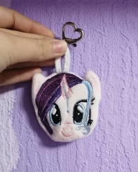 Size: 1080x1350 | Tagged: safe, artist:rxndxm.artist, oc, oc only, pony, unicorn, bust, female, horn, irl, keychain, mare, photo, plushie, smiling, solo, unicorn oc