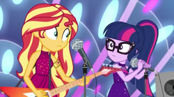 Size: 1920x1068 | Tagged: safe, screencap, sci-twi, sunset shimmer, twilight sparkle, equestria girls, equestria girls series, g4, spring breakdown, spoiler:eqg series (season 2), bare shoulders, electric guitar, guitar, microphone, microphone stand, musical instrument, shrunken pupils, sleeveless, speaker, stage
