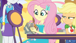 Size: 3410x1920 | Tagged: safe, screencap, applejack, fluttershy, rarity, dashing through the mall, equestria girls, equestria girls series, g4, holidays unwrapped, spoiler:eqg series (season 2), applejack is not amused, applejack's hat, bracelet, clothes, cowboy hat, cute, cutie mark, cutie mark on clothes, denim skirt, female, geode of fauna, geode of shielding, geode of super strength, hairpin, hat, high res, jewelry, legs together, magical geodes, necklace, purple skirt, rarity peplum dress, shyabetes, skirt, smiling, unamused